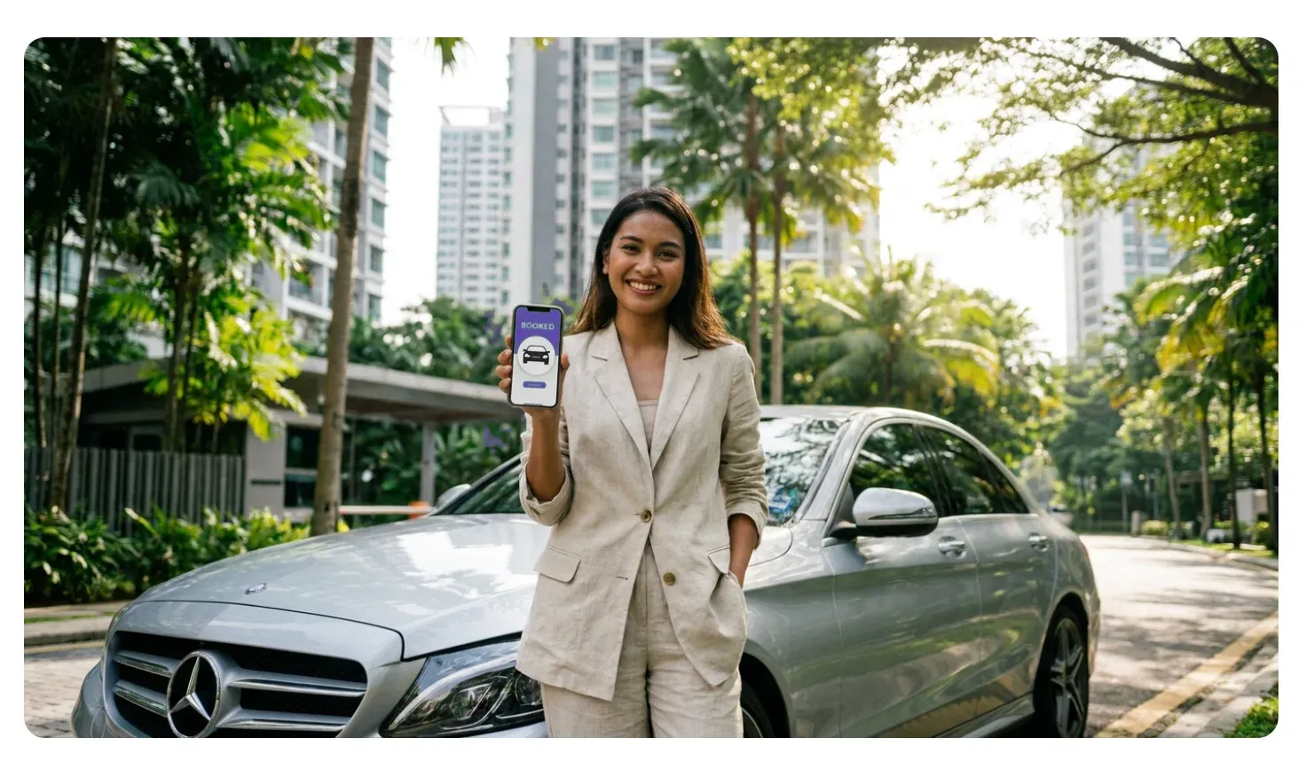 Happy person next to car showing booking app