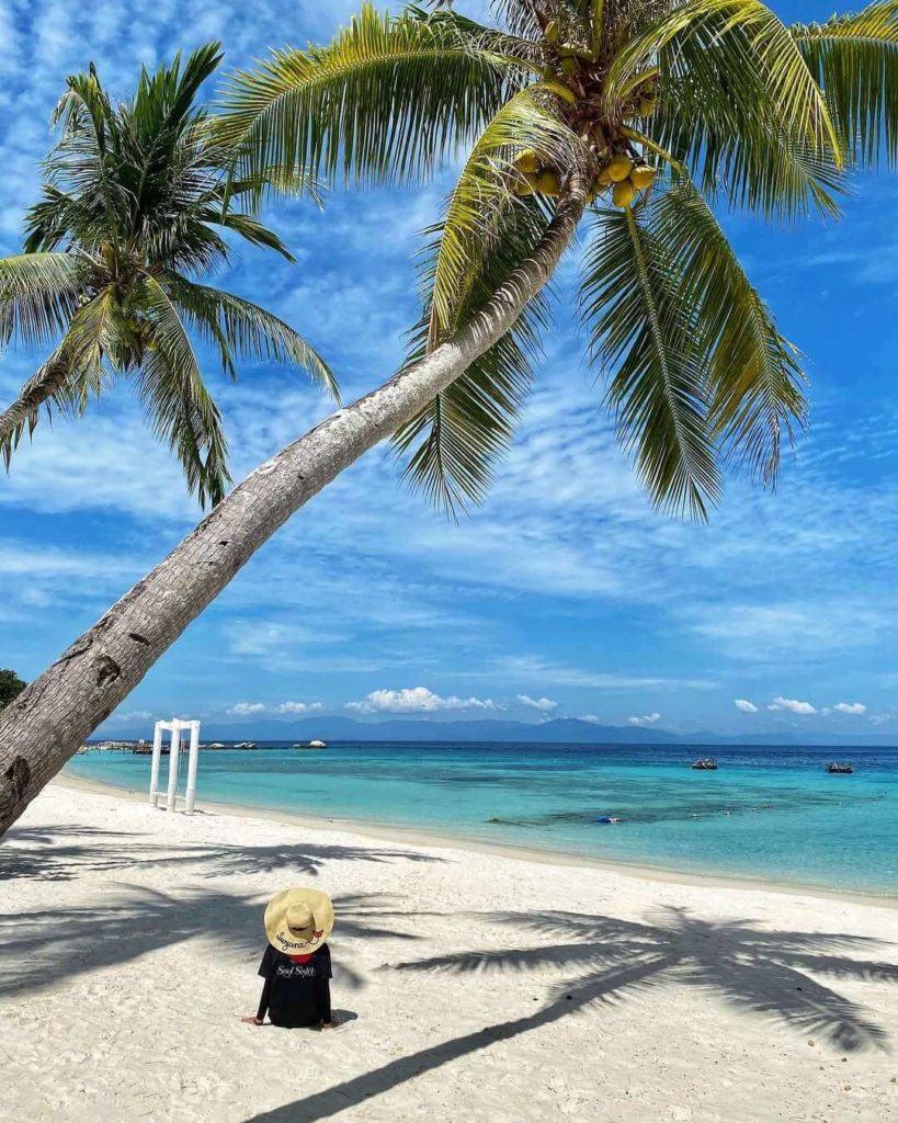 person relaxing by lang tengah beach, one of the top 10 best beaches in terengganu