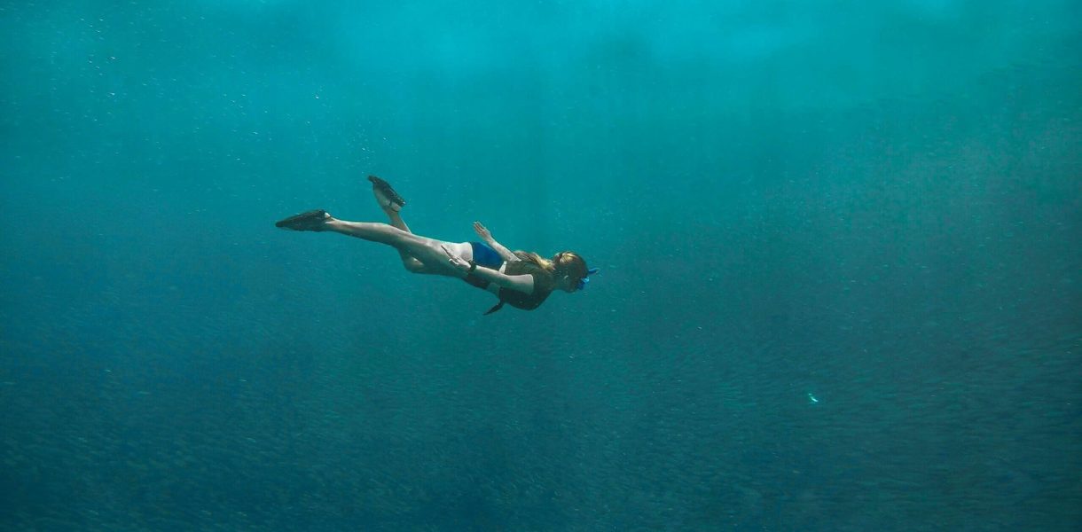 girl exploring one of the diving sites in malaysia
