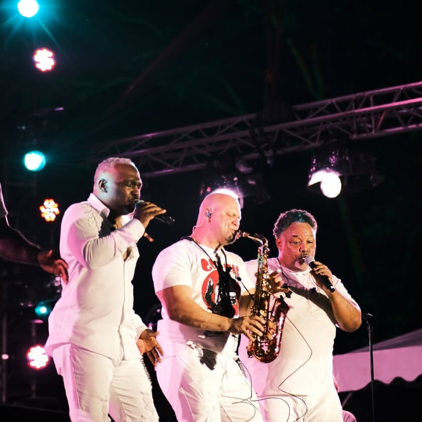 Three men performing for Rainforest World Music Festival